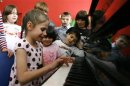 Orphan children play music at an orphanage in the southern Russian city of Rostov-on-Don