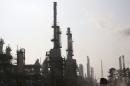 General view of part of Tehran's oil refinery south of the capital Tehran, Iran, Monday, Dec. 22, 2014. (AP Photo/Vahid Salemi)