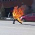 In this photo taken Tuesday, Oct 23, 2012 and released by London-based rights group Freetibet.org, Dorje Rinchen, a farmer in his late 50s, runs after setting himself on fire on the main street in Xiahe in northwestern China's Gansu province. This was the second self-immolation death in two days near the Labrang monastery in Xiahe. The monastery is one of the most important outside of Tibet and was the site of numerous protests by monks following deadly ethnic riots in Tibet in 2008 that were the most sustained Tibetan uprising against Chinese rule in decades. (AP Photo/Freetibet.org) EDITORIAL USE ONLY, NO SALES