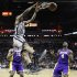 San Antonio Spurs' Kawhi Leonard (2) scores over Los Angeles Lakers' Antawn Jamison (4) and Metta World Peace (15) during the first half of Game 2 of a first-round NBA basketball playoff series on Wednesday, April 24, 2013, in San Antonio, Texas. (AP Photo/Eric Gay)