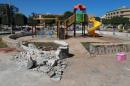 Rubble is seen at a playground in a garden where a rocket hit a residential district in Benghazi