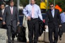 Former Major League Baseball pitcher Roger Clemens, center, arrives at federal court in Washington, Tuesday, May 29, 2012, for his perjury trial. (AP Photo/Evan Vucci)