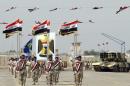 Iraqi Army soldiers march as part of a parade marking the founding anniversary of the army's artillery section in Baghdad