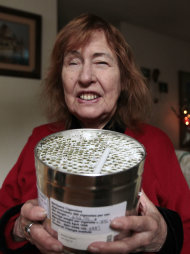 Elvy Musikka, 72, who suffers from glaucoma, shows the canister holding marijuana cigarettes she regularly receives from the U.S. Government in Eugene, Ore., Tuesday, Sept. 27, 2011. For the past three decades, the federal government has been providing a handful of patients with some of the highest grade marijuana around. The program grew out of a 1976 court settlement that created the country’s first legal pot smoker. (AP Photo/Don Ryan)