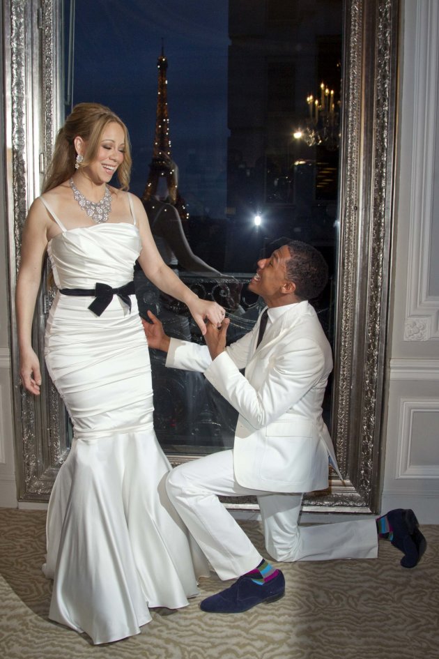 Musician Carey and husband Cannon attend a photo call near the Eiffel Tower before their vow renewal ceremony in Paris
