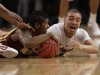 Minnesota's Maverick Ahanmisi, left, and Stanford's Aaron Bright, right, fight for control of a loose ball during the first half of the NIT college basketball tournament final on Thursday, March 29, 2012, in New York. (AP Photo/Frank Franklin II)