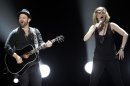 FILE - In this Oct. 28, 2011, file photo the American country music duo Sugarland, featuring vocalist Jennifer Nettles, right, and guitarist Kristian Bush perform a benefit concert in Indianapolis for victims of the Aug. 13 Indiana fair stage collapse. In a Feb. 16, 2012, response to a civil suit filed in November, attorneys for Sugarland say the injuries fans suffered in the deadly collapse were their own fault because they failed to take steps to ensure their own safety before high winds toppled stage rigging. (AP Photo/AJ Mast, File)