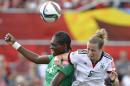 Germany's Simone Laudehr (6) battles for the ball with Ivory Coast's Josee Nahi (14) during first half FIFA Women's World Cup soccer action in Ottawa, Ontario on Sunday, June 7, 2015. (Justin Tang/The Canadian Press via AP) MANDATORY CREDIT