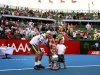 Australia's Hewitt poses with his children Mia, Ava and Cruz and the trophy after he defeated Argentina's Del Potro in the final at the Kooyong Classic tennis tournament in Melbourne