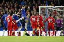 Chelsea's Branislav Ivanovic, top, heads the ball and scores during the English League Cup semifinal second leg soccer match between Chelsea and Liverpool at Stamford Bridge stadium in London, Tuesday, Jan. 27, 2015. (AP Photo/Alastair Grant)