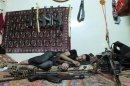 A member of rebel group Khaled ibin al Walid Fighters rests in a temporary house used by rebels at Hamidiyeh district in Homs