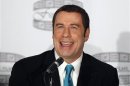 Actor John Travolta speaks during a news conference to promote the film 