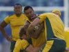 Beale of Australia's Wallabies with ball in hand is tackled by Pocock and Sharpe during training ahead of their Tri-Nations rugby union match against South Africa in Durban
