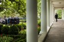 US President Barack Obama walks through the colonnade at the White House