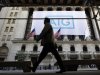 A banner for American International Group Inc hangs on the facade of the New York Stock Exchange