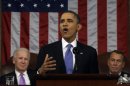 President Barack Obama, flanked by Vice President Joe Biden and House Speaker John Boehner of Ohio, gestures as he gives his State of the Union address during a joint session of Congress on Capitol Hill in Washington, Tuesday Feb. 12, 2013. (AP Photo/Charles Dharapak, Pool)