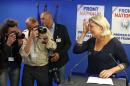 Far right party National Front leader Marine Le Pen poses for photographers before addressing reporters at the party's headquarters in Nanterre, west of Paris, Sunday May 25, 2014, following the victory of her party in the European Elections. (AP Photo / Remy de la Mauviniere)
