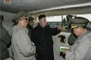 Still image taken from video shows North Korean leader Kim Jong-un speaking with senior military officials at an undisclosed location