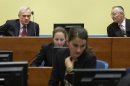 Former state security chief Jovica Stanisic, left, and former paramilitary leader Franko Simatovic, right, await their judgment at the Yugoslav war crimes tribunal (ICTY) in The Hague, Netherlands, Thursday May 30, 2013. The ICTY is set to deliver verdicts in the trial of two senior Serb security officials accused of supporting rebels who murdered Muslims and Croats in Bosnia's 1992-95 war. (AP Photo/Martijn Beekman, Pool)