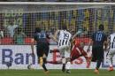 Juventus' Claudio Marchisio, right scores on a penalty kick during a Serie A soccer match between Inter Milan and Juventus, at the San Siro stadium in Milan, Italy, Saturday, May 16, 2015. (AP Photo/Luca Bruno)