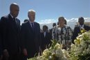 Haiti's President Martelly, former U.S. president Clinton and Haiti's First Lady Martelly visit a memorial service remembering lives lost in the January 2010 earthquake at the mass burial site at Morne St. Christophe
