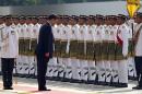 Chinese President Xi Jinping, foreground right, bows as he inspects a guard of honor during a welcoming ceremony at Parliament Square in Kuala Lumpur, Malaysia, Friday, Oct. 4, 2013. Xi is on a three-day state visit to Malaysia. (AP Photo/Lai Seng Sin)