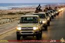 An image from Islamist media outlet Welayat Tarablos on February 18, 2015 allegedly shows members of the Islamic State group parading in a street in Libya's coastal city of Sirte