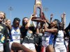 CORRECTS TO KANSAS NOT KANSAS STATE - Kansas women's track team celebrates after winning the NCAA outdoor track and field championships in Eugene, Ore., Saturday, June 8, 2013. (AP Photo/Don Ryan)