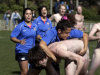 EDS NOTE: NUDITY - Spanish Conquistadoras' Anna Paloma tackles Dunedin's Nude Blacks player during their friendly rugby match at Kettle Park in Dunedin, New Zealand, Saturday, Sept. 10, 2011, prior to the Rugby World Cup match between England and Argentina. (AP Photo/Natacha Pisarenko)