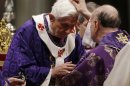 Cardinal Angelo Comastri puts ash on Pope Benedict XVI's head during the celebration of Ash Wednesday mass in St. Peter's Basilica at the Vatican, Wednesday, Feb. 13, 2013. Ash Wednesday marks the beginning of Lent, a solemn period of 40 days of prayer and self-denial leading up to Easter. Pope Benedict XVI told thousands of faithful Wednesday that he was resigning for "the good of the church", an extraordinary scene of a pope explaining himself to his flock that unfolded in his first appearance since dropping the bombshell announcement. (AP Photo/Gregorio Borgia)