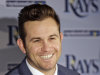 Tampa Bay Rays third baseman Evan Longoria smiles as he answers questions during a news conference after signing a six-year, $100 million, contract extension Monday, Nov. 26, 2012, in St. Petersburg, Fla. Longoria is signed with the Rays through the 2022 season. (AP Photo/Chris O'Meara)