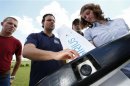 Niesen of MAVinci explains the camera equipped "Sirius" UAV during a training session for clients on an airfield for model aircraft in Walldorf near Heidelberg