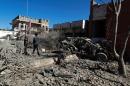 Yemenis inspect the damage following an air-strike by the Saudi-led coalition in the capital Sanaa, on February 27, 2016