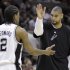 San Antonio Spurs' Tim Duncan, right, celebrates with teammate Kawhi Leonard (2) during the fourth quarter of an NBA basketball game against the Portland Trail Blazers, Monday, April 23, 2012, in San Antonio. San Antonio won 124-89, clinching the No. 1 seed in the Western Conference. (AP Photo/Eric Gay)