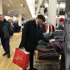 In this Dec. 13, 2011 photo, Jerry Clay of Chicago, shops at the Macy's on State Street store, in Chicago. The U.S. economy will grow faster in 2012 _ if it isn’t knocked off track by upheavals in Europe, according to an Associated Press survey of leading economists. (AP Photo/Charles Rex Arbogast)