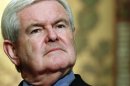 FILE - In this March 28, 2012, file photo Republican presidential candidate, former House Speaker Newt Gingrich, waits to speak at Georgetown University in Washington. Gingrich, who once led his rivals for the nomination in polls, is today millions in debt and describing Mitt Romney as 