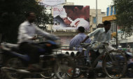 Indian commuters move past a poster of Bollywood film
    “Jism 2” in Hyderabad, India, Thursday, Aug. 2, 2012. "Jism 2"
    stars a hard-core porn actress, and it does have that pesky title. But
    it’s not a porn movie. Bollywood is certainly not ready for that. The
    film, which will be released across India on Friday, is pushing the
    ever-widening sexual boundaries enjoyed by many in urban India. (AP
    Photo/Mahesh Kumar A.)