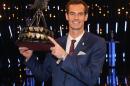 British tennis player Andy Murray poses with the trophy after winning the 2015 Sports Personality of the Year, in Belfast, Northern Ireland, Sunday Dec. 20, 2015. (Niall Carson/PA via AP) UNITED KINGDOM OUT