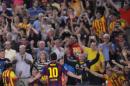 El delantero argentino Lionel Messi celebra tras marcar un gol ante Elche en la liga española, el domingo 24 de agosto de 2014. (AP Foto/Manu Fernandez)