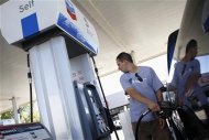 A man pumps fuel into his truck at a Chevron gas station in Buckeye, Arizona October 27, 2011. REUTERS/Joshua Lott