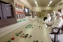 File photos of technicians of Iran's Atomic Energy Organisation in a control room at the Uranium Conversion Facility in Isfahan