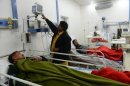 Patients who consumed toxic cough syrup receive treatment in a hospital in Gujranwala on December 29, 2012