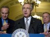 Reid stands with Schumer and Durbin as he talks to reporters about the senate's vote on debt ceiling legislation at the U.S. Capitol in Washington