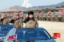 North Korean leader Kim Jong Un salutes as he arrives to inspect a military drill at an unknown location, in this undated photo released by North Korea's Korean Central News Agency (KCNA)