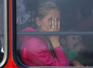 Syrian migrants sit in a bus to register in a camp&nbsp;&hellip;