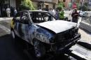 A handout picture released by the Syrian Arab News Agency (SANA) shows a car that was destroyed in a mortar attack on the Abu Rummaneh neighbourhood of Damascus, on October 12, 2013