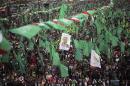 Palestinian Hamas supporters take part in a Hamas rally marking the anniversary of the death of its leaders killed by Israel in Gaza