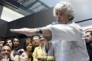 Leader of the anti-establishment 5-Star Movement Grillo gestures during a news conference in Rome