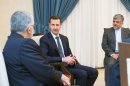 Syrian President Bashar al-Assad (C) with Iranian lawmaker Aladin Borujerdi (L) in Damascus, September 1, 2013