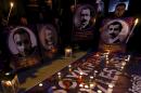 Demonstrators hold candles and pictures of Armenian victims during a commemoration for the victims of mass killings of Armenians by Ottoman Turks, in Istanbul